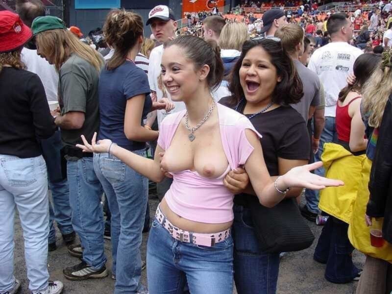 cute Brunette Girl flashing her boobs in a concert
