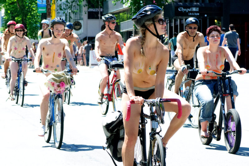 Naked people riding bicycle