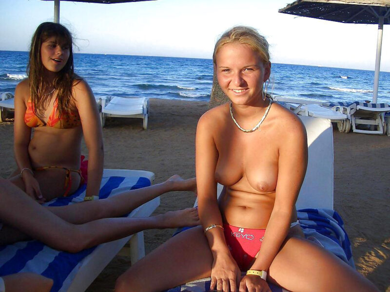 Blonde teen topless on the beach