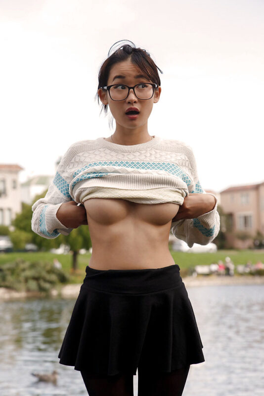 Saki Kishima (Miki Hamano) pulling up her sweater to reveal her tits